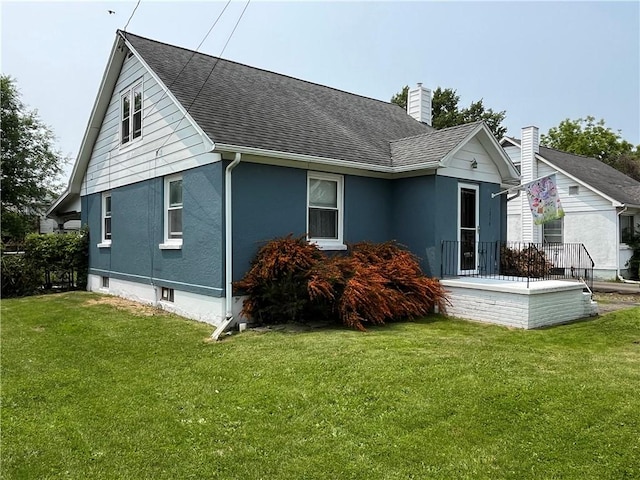 1214 S Main, Southport, NY 14904 - view of property exterior with roof with shingles, a lawn, and a chimney