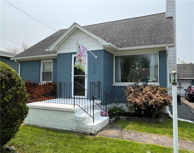 1214 S Main, Southport, NY 14904 - view of front of home with roof with shingles, a chimney, and stucco siding