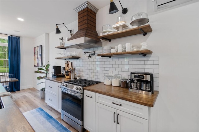 7698 Ridge Rd, Sodus, NY 14551 - kitchen featuring stainless steel range with gas cooktop, wood counters, open shelves, backsplash, and recessed lighting