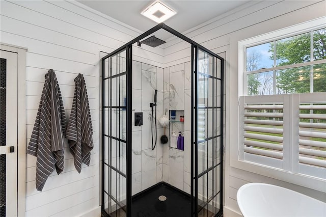 7698 Ridge Rd, Sodus, NY 14551 - full bathroom with a freestanding tub, wooden walls, and a shower stall