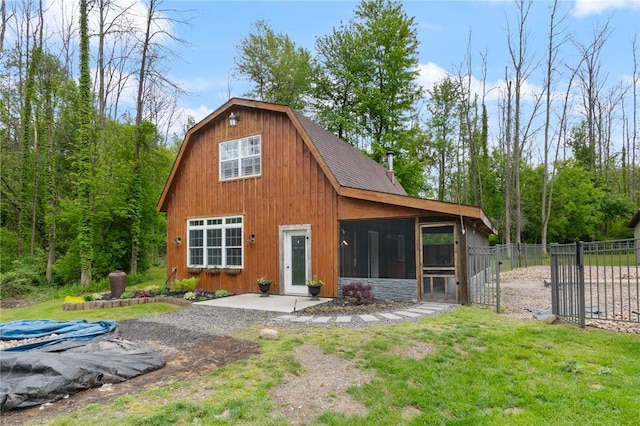 7698 Ridge Rd, Sodus, NY 14551 - rear view of house featuring a sunroom, a gate, and a shingled roof