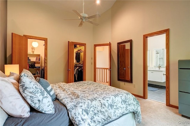3502 Lightfoot Ln, Lysander, NY 13027 - bedroom featuring light colored carpet, a spacious closet, high vaulted ceiling, a closet, and baseboards