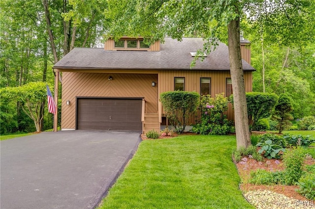 3502 Lightfoot Ln, Lysander, NY 13027 - view of front of property with a front yard, an attached garage, driveway, and a shingled roof
