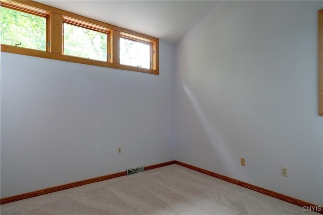 3502 Lightfoot Ln, Lysander, NY 13027 - unfurnished room featuring light colored carpet, lofted ceiling, and baseboards