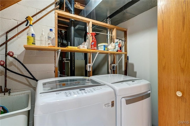 3502 Lightfoot Ln, Lysander, NY 13027 - laundry area with separate washer and dryer and concrete block wall