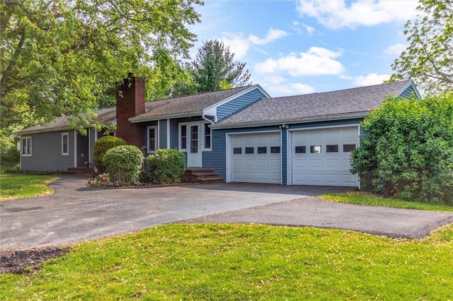 4411 Williamson Rd, Marion, NY 14505 - ranch-style home with driveway, a chimney, an attached garage, a front yard, and a shingled roof