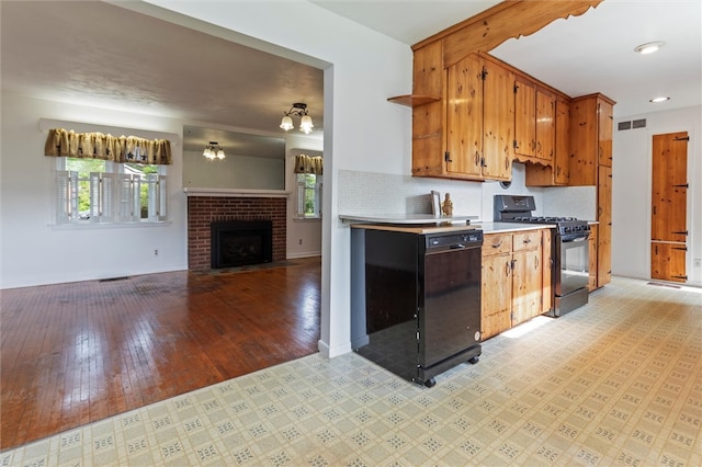 4411 Williamson Rd, Marion, NY 14505 - kitchen with gas stove, dishwasher, plenty of natural light, light countertops, and recessed lighting