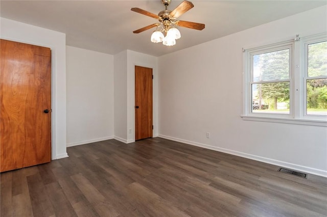 4411 Williamson Rd, Marion, NY 14505 - unfurnished room featuring baseboards, dark wood-style floors, and ceiling fan