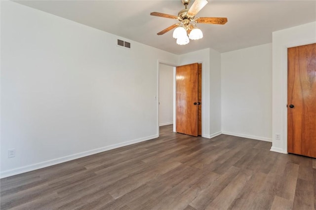 4411 Williamson Rd, Marion, NY 14505 - empty room with dark wood finished floors, a ceiling fan, and baseboards