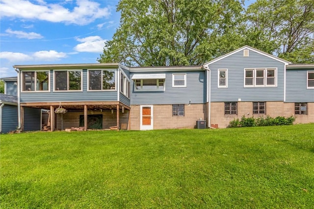 4411 Williamson Rd, Marion, NY 14505 - rear view of house featuring central AC, a sunroom, and a lawn