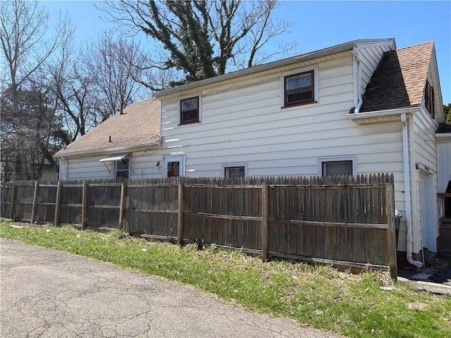 1563 Norton St, Rochester, NY 14621 - view of side of home with roof with shingles