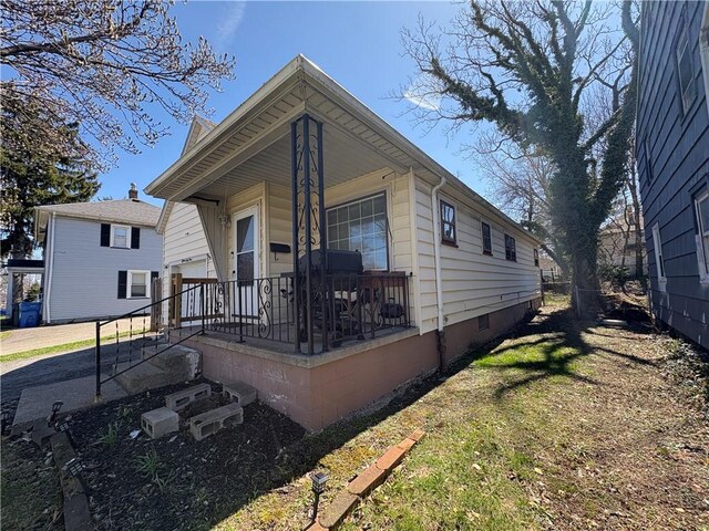 1563 Norton St, Rochester, NY 14621 - view of front of home with crawl space and covered porch