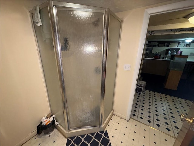 1563 Norton St, Rochester, NY 14621 - full bath with tile patterned floors, a shower stall, and baseboards