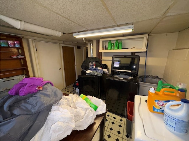 1563 Norton St, Rochester, NY 14621 - finished basement featuring a drop ceiling, light flooring, and washing machine and dryer