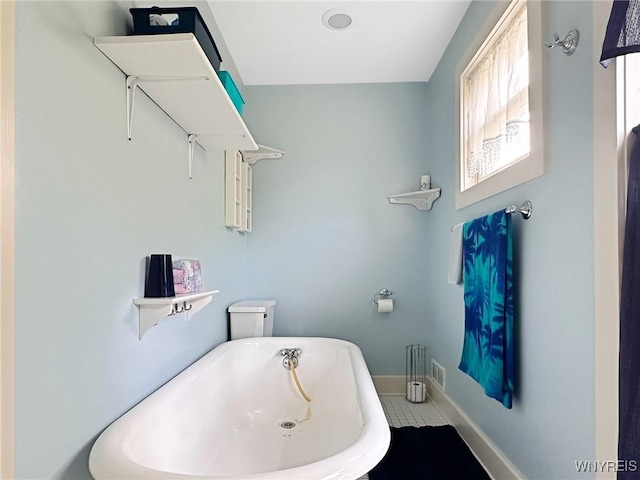 4 Park Rd W, Castile, NY 14427 - bathroom featuring a freestanding bath and baseboards