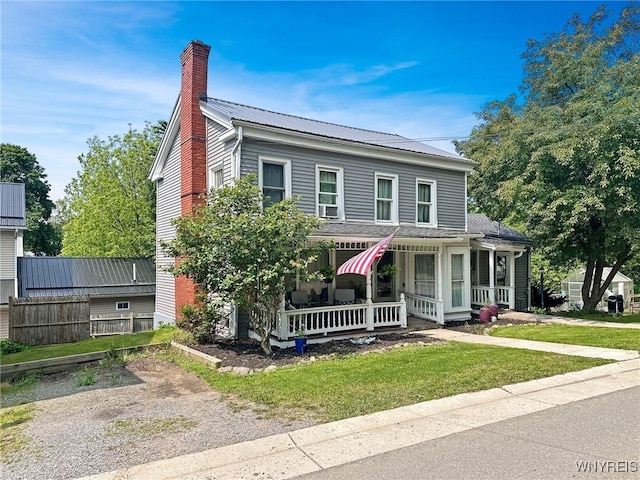 4 Park Rd W, Castile, NY 14427 - view of front facade featuring a chimney and covered porch