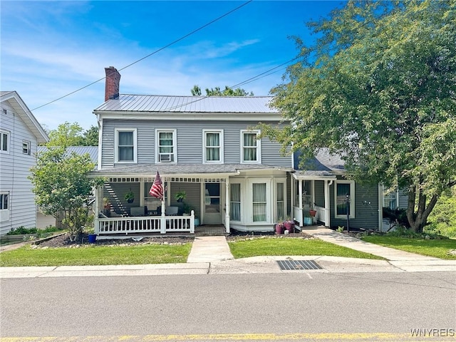 4 Park Rd W, Castile, NY 14427 - view of front of home with covered porch, a chimney, and metal roof