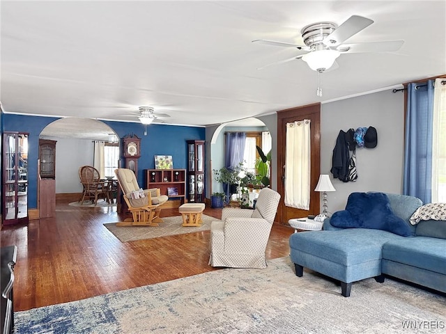 4 Park Rd W, Castile, NY 14427 - living area featuring ceiling fan, arched walkways, healthy amount of natural light, and wood finished floors