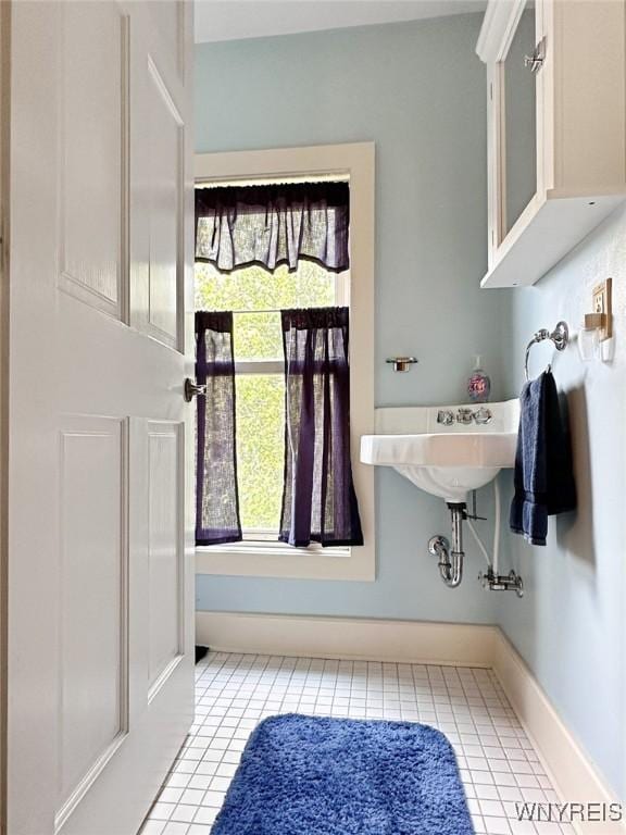 4 Park Rd W, Castile, NY 14427 - bathroom with tile patterned floors, plenty of natural light, and baseboards