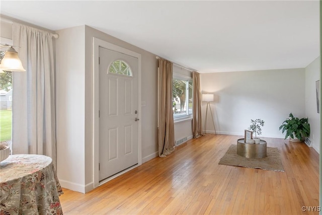 211 Fletcher Dr, Clay, NY 13212 - foyer with light wood finished floors and baseboards