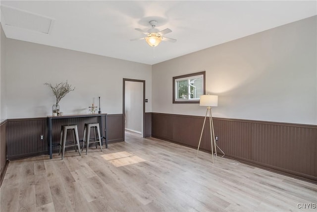 211 Fletcher Dr, Clay, NY 13212 - dining room featuring a wainscoted wall, ceiling fan, and wood finished floors