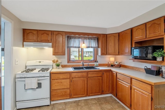 211 Fletcher Dr, Clay, NY 13212 - kitchen with white range with gas cooktop, under cabinet range hood, a sink, black microwave, and light countertops