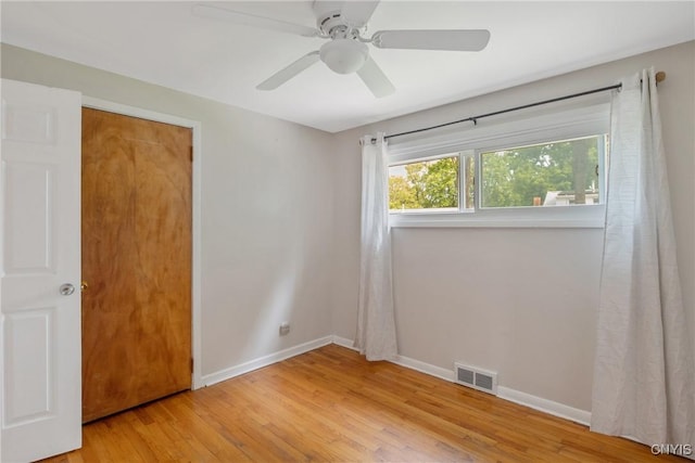 211 Fletcher Dr, Clay, NY 13212 - unfurnished room featuring wood finished floors, baseboards, and a ceiling fan