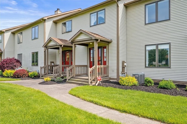 8 Harrier Cir, Henrietta, NY 14623 - view of front of property featuring a front lawn, cooling unit, and a chimney