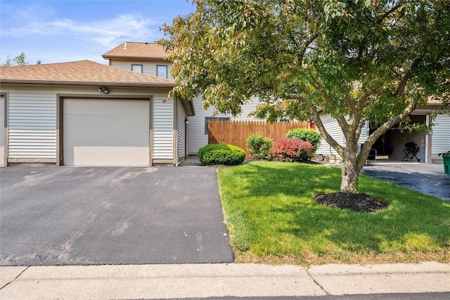 8 Harrier Cir, Henrietta, NY 14623 - view of property hidden behind natural elements with driveway, a garage, an outdoor structure, and roof with shingles