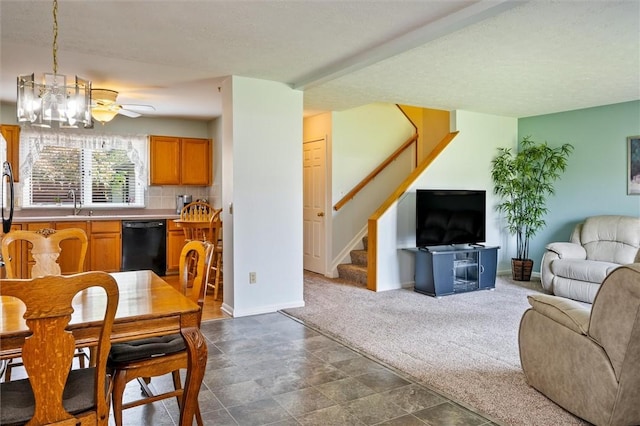 8 Harrier Cir, Henrietta, NY 14623 - dining space with stairway, baseboards, a chandelier, and dark carpet