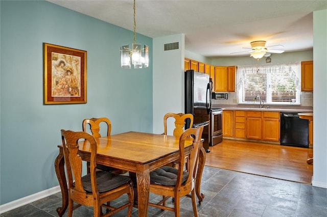 8 Harrier Cir, Henrietta, NY 14623 - dining room featuring a chandelier, ceiling fan, and baseboards