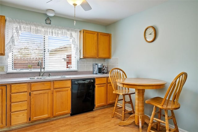 8 Harrier Cir, Henrietta, NY 14623 - kitchen featuring black dishwasher, a sink, decorative backsplash, light wood finished floors, and a ceiling fan