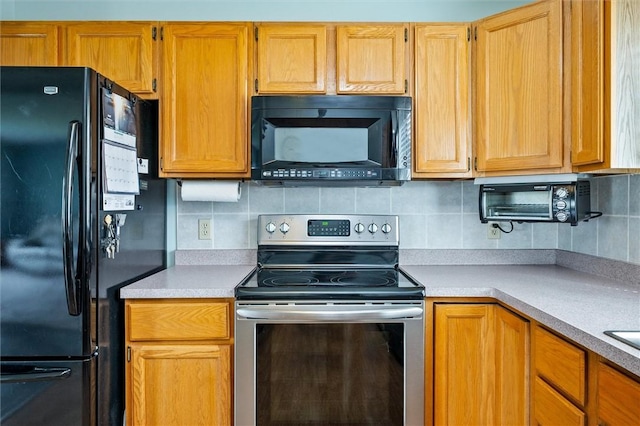 8 Harrier Cir, Henrietta, NY 14623 - kitchen with black appliances, light countertops, and backsplash