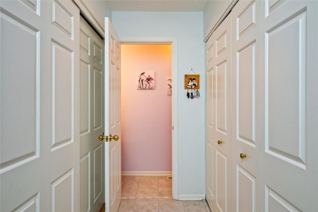 8 Harrier Cir, Henrietta, NY 14623 - hallway featuring baseboards and light tile patterned flooring