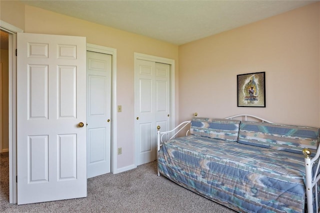 8 Harrier Cir, Henrietta, NY 14623 - bedroom featuring carpet floors, two closets, and baseboards