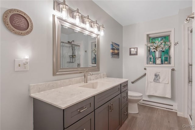 1388 Sky High Rd, Fabius, NY 13159 - full bath featuring baseboard heating, vanity, wood finished floors, toilet, and a shower