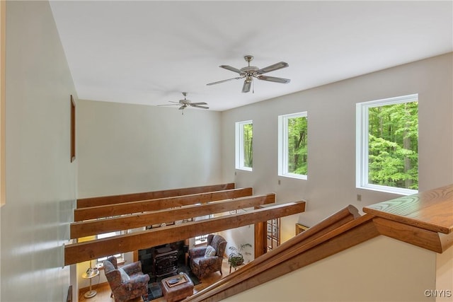 1388 Sky High Rd, Fabius, NY 13159 - stairway with a wood stove and ceiling fan