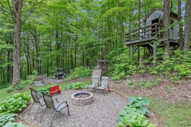 1388 Sky High Rd, Fabius, NY 13159 - view of patio featuring a fire pit and a wooden deck