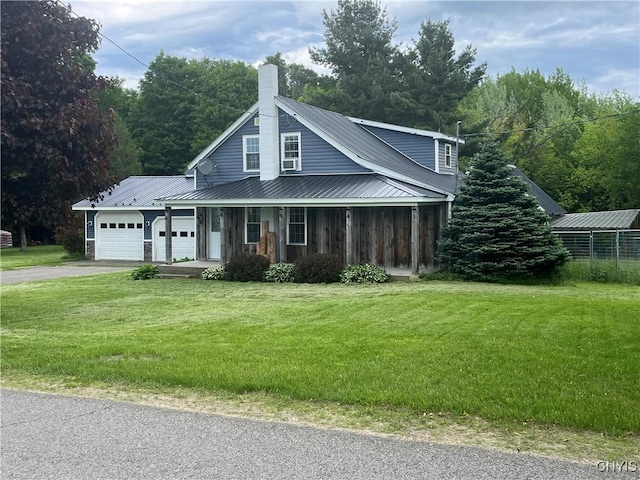 808 Fay, Bangor, NY 12966 - view of front of house featuring driveway, an attached garage, a chimney, and a front lawn