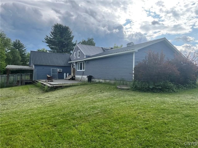 808 Fay, Bangor, NY 12966 - rear view of house with a deck, metal roof, and a yard