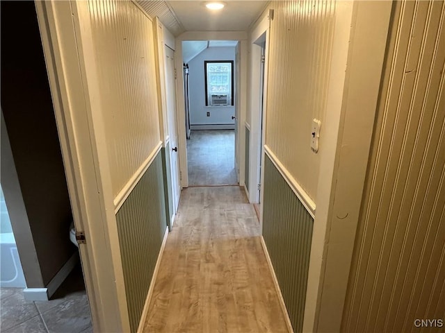 808 Fay, Bangor, NY 12966 - hall featuring light wood-style flooring, a baseboard radiator, a wainscoted wall, and cooling unit