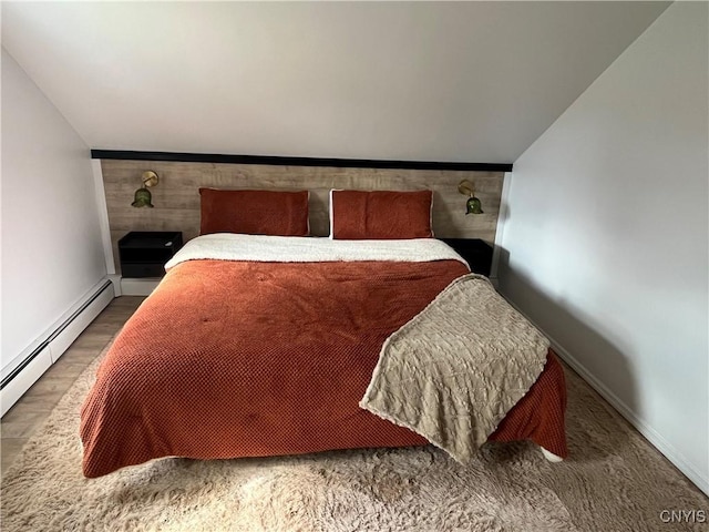 808 Fay, Bangor, NY 12966 - bedroom with a baseboard heating unit, baseboards, and vaulted ceiling