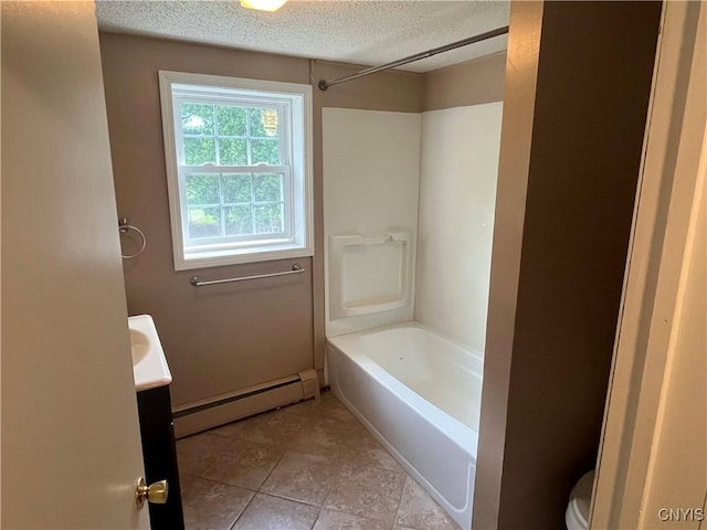 808 Fay, Bangor, NY 12966 - bathroom with a baseboard heating unit, toilet, a textured ceiling, vanity, and  shower combination