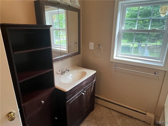 808 Fay, Bangor, NY 12966 - bathroom with a baseboard radiator, vanity, plenty of natural light, and tile patterned floors