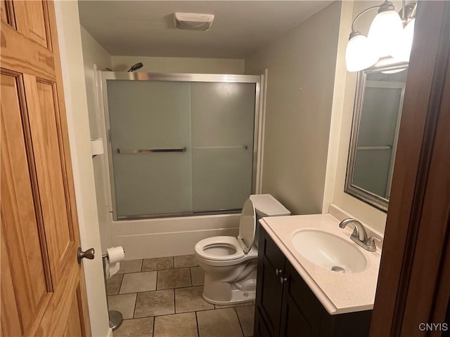 808 Fay, Bangor, NY 12966 - bathroom featuring toilet, vanity, bath / shower combo with glass door, and tile patterned floors