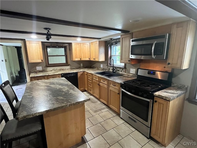 808 Fay, Bangor, NY 12966 - kitchen featuring stainless steel appliances, a sink, a center island, a breakfast bar area, and light tile patterned floors