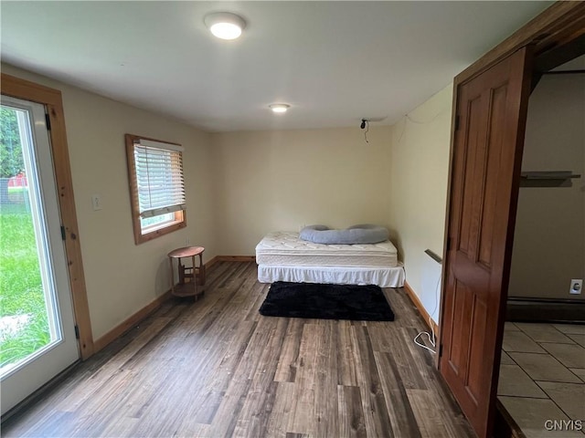 808 Fay, Bangor, NY 12966 - bedroom with multiple windows, wood finished floors, and baseboards