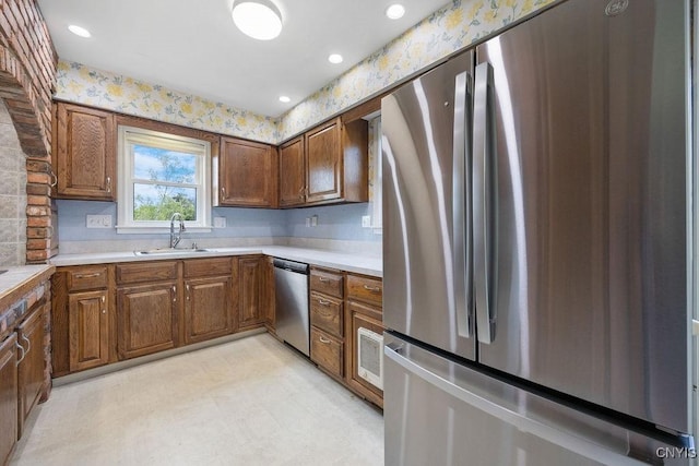 7739 Number 5 W Rd, Pompey, NY 13063 - kitchen featuring stainless steel appliances, a sink, light countertops, brown cabinets, and light flooring