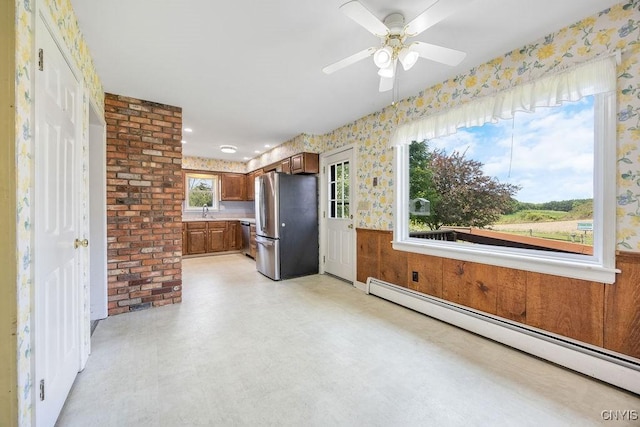 7739 Number 5 W Rd, Pompey, NY 13063 - unfurnished living room featuring a baseboard heating unit, light floors, a sink, wallpapered walls, and ceiling fan