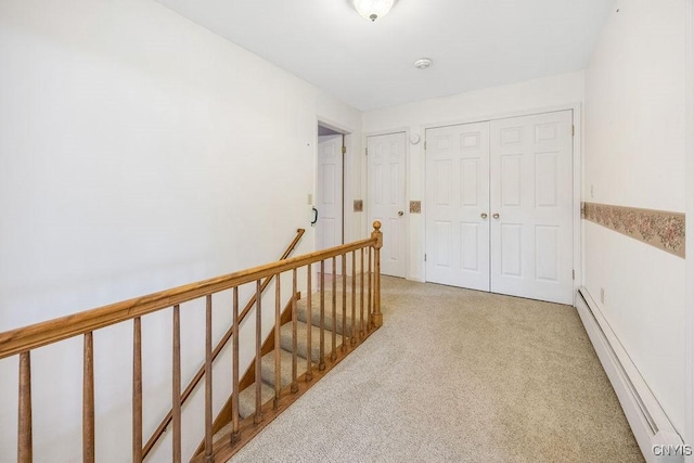 7739 Number 5 W Rd, Pompey, NY 13063 - hallway featuring a baseboard heating unit, light carpet, and an upstairs landing
